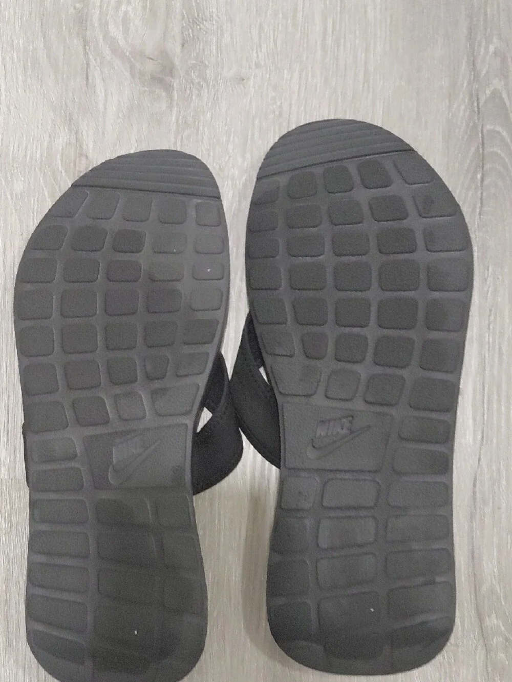 Nike Black Slip-On Sandals with White Swoosh Accent